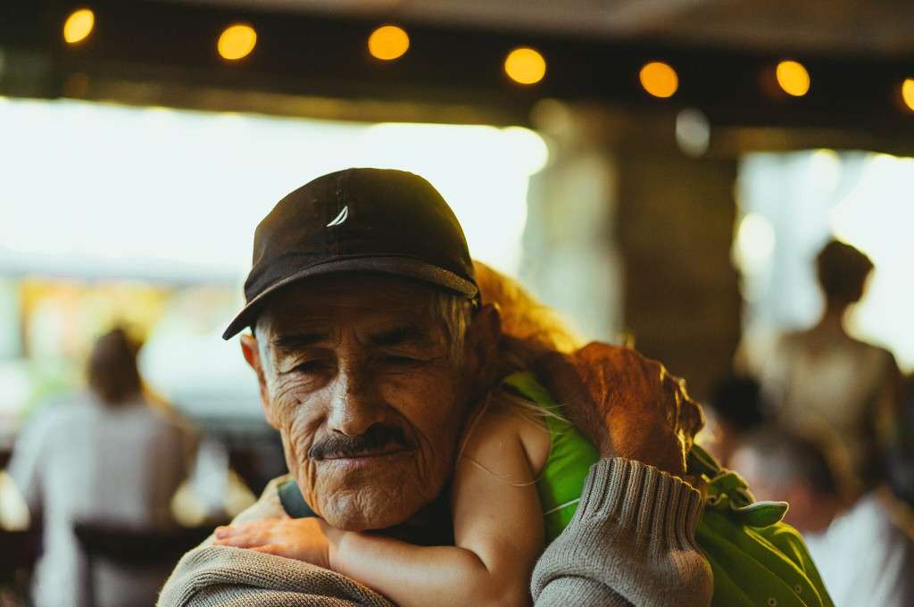 grandfather hugging child